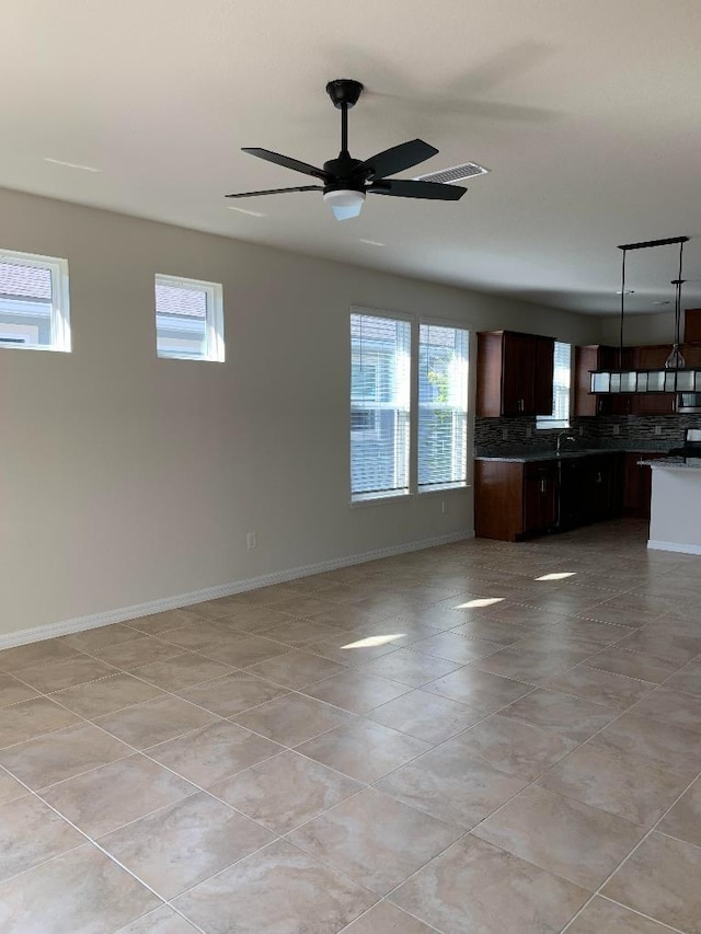 46 Curved Bay Trl, Ponte Vedra, FL 32081 - unfurnished living room featuring a wealth of natural light, baseboards, visible vents, and ceiling fan