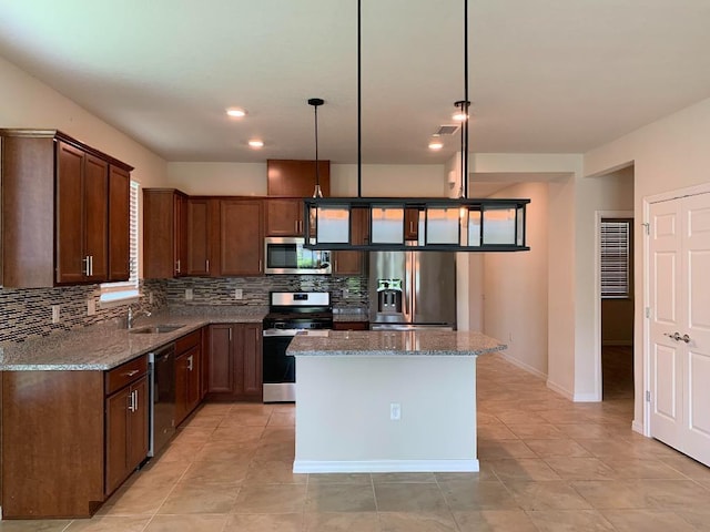 46 Curved Bay Trl, Ponte Vedra, FL 32081 - kitchen with a sink, a kitchen island, light stone countertops, tasteful backsplash, and stainless steel appliances