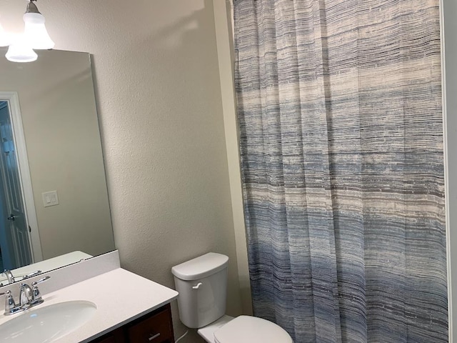 46 Curved Bay Trl, Ponte Vedra, FL 32081 - bathroom with a textured wall, curtained shower, toilet, and vanity