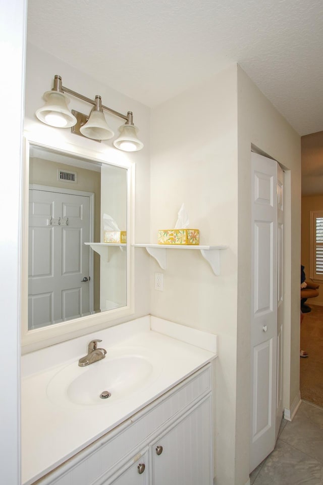 23213 Harbour Vista Cir, Saint Augustine, FL 32080 - bathroom with vanity, tile patterned floors, and visible vents
