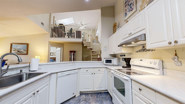 kitchen featuring white appliances, white cabinetry, ceiling fan, and sink