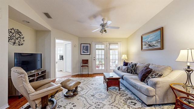 23213 Harbour Vista Cir, Saint Augustine, FL 32080 - living room featuring visible vents, a ceiling fan, baseboards, and wood finished floors
