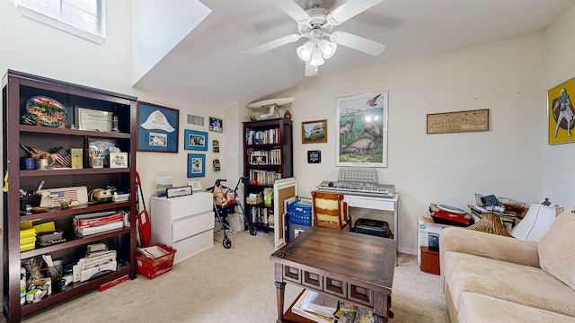 office space with light carpet, vaulted ceiling, and ceiling fan