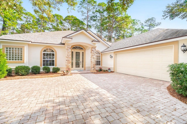 view of front of home featuring french doors and a garage