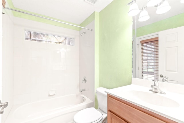 full bathroom featuring vanity, toilet, and tiled shower / bath