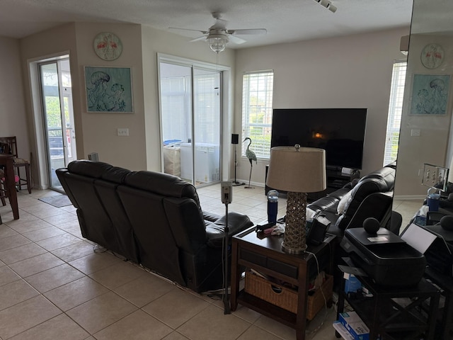 1810 Prestwick Pl, Saint Augustine, FL 32086 - living room with light tile patterned flooring, ceiling fan, plenty of natural light, and baseboards