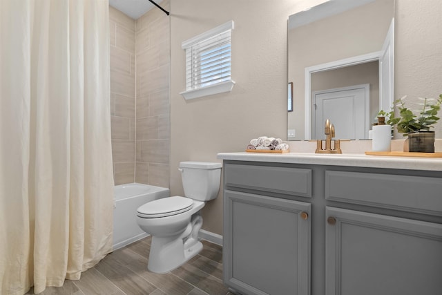 full bathroom with toilet, vanity, shower / bathtub combination with curtain, and hardwood / wood-style floors