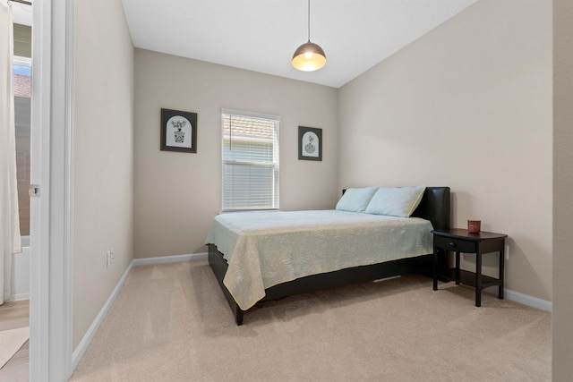 bedroom with light colored carpet