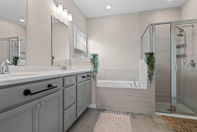 bathroom featuring vanity and plus walk in shower