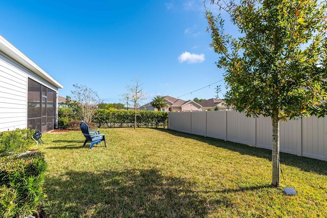 view of yard with a sunroom