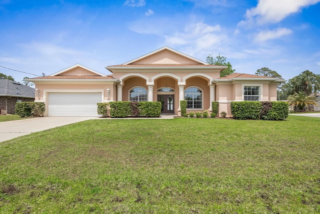 19 Ehrling Ln, Palm Coast, FL 32164 - view of front of property with stucco siding, driveway, and a front yard