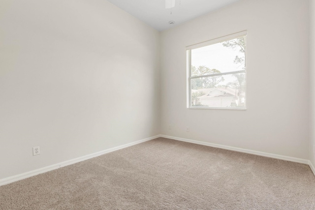 19 Ehrling Ln, Palm Coast, FL 32164 - carpeted spare room with baseboards and a ceiling fan