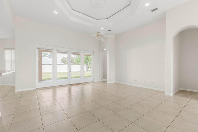 19 Ehrling Ln, Palm Coast, FL 32164 - empty room featuring arched walkways, light tile patterned flooring, ceiling fan, recessed lighting, and a high ceiling