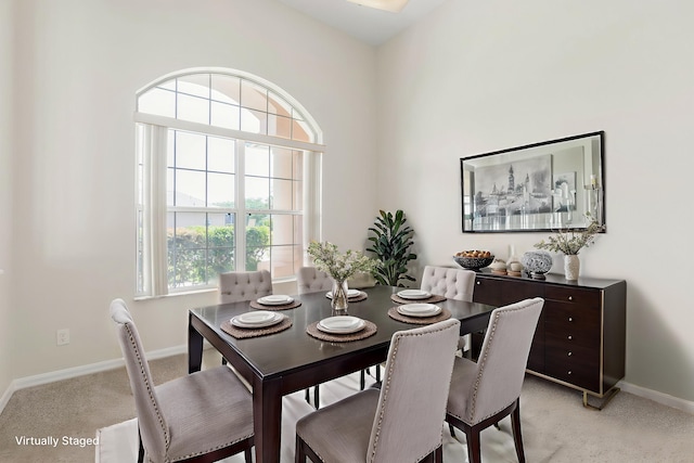 19 Ehrling Ln, Palm Coast, FL 32164 - dining space featuring light carpet and baseboards