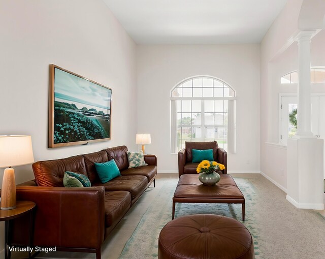 19 Ehrling Ln, Palm Coast, FL 32164 - carpeted living area featuring decorative columns and baseboards