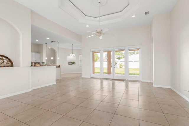 19 Ehrling Ln, Palm Coast, FL 32164 - unfurnished living room with recessed lighting, light tile patterned flooring, a ceiling fan, a towering ceiling, and baseboards