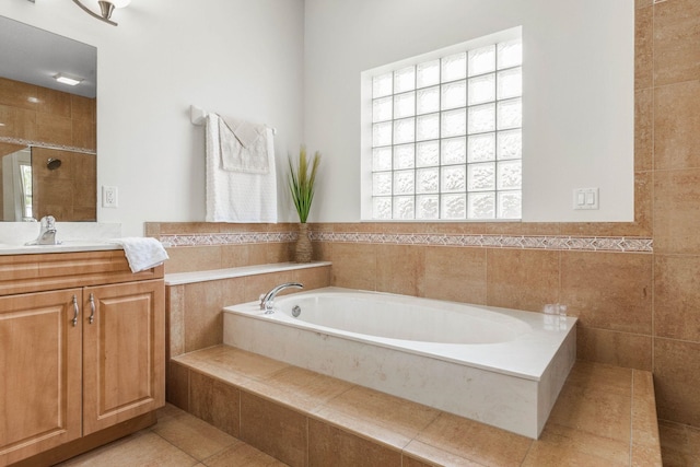 19 Ehrling Ln, Palm Coast, FL 32164 - full bathroom featuring a garden tub, vanity, tiled shower, and tile patterned flooring