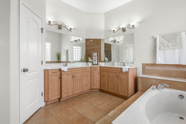 19 Ehrling Ln, Palm Coast, FL 32164 - full bath featuring a chandelier, a bath, double vanity, and tile patterned flooring