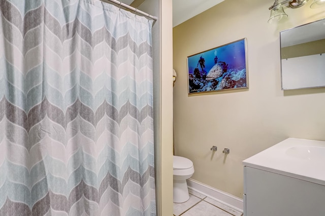 bathroom with vanity, tile patterned floors, toilet, and walk in shower