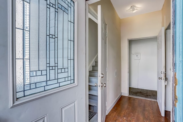 doorway to outside featuring dark wood-type flooring