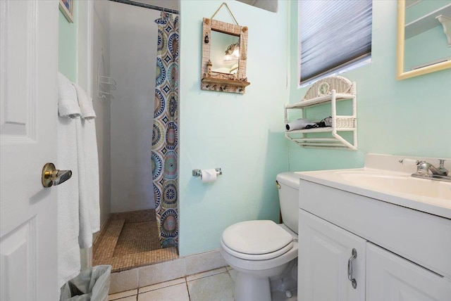 bathroom with tile patterned flooring, vanity, toilet, and curtained shower