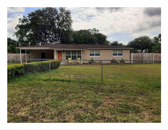 single story home with a carport and a front lawn