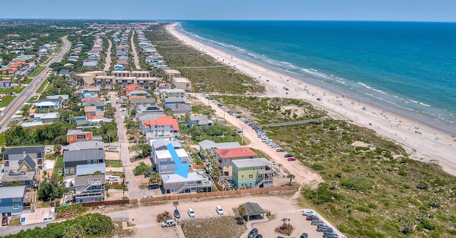 birds eye view of property featuring a view of the beach and a water view