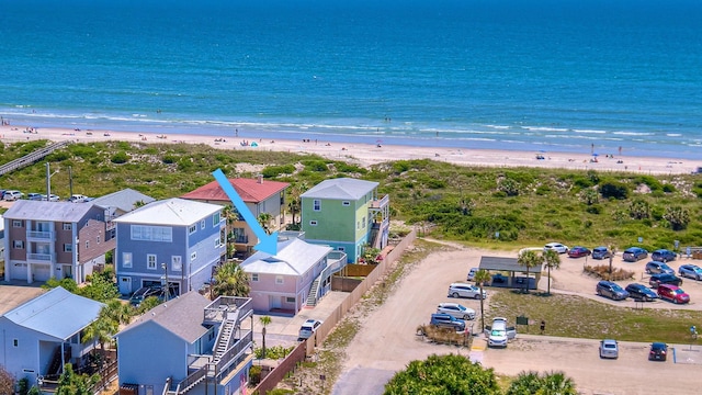 bird's eye view featuring a view of the beach and a water view