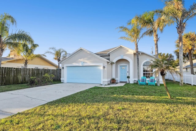 ranch-style home with a front lawn and a garage