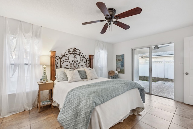 tiled bedroom featuring ceiling fan and access to outside