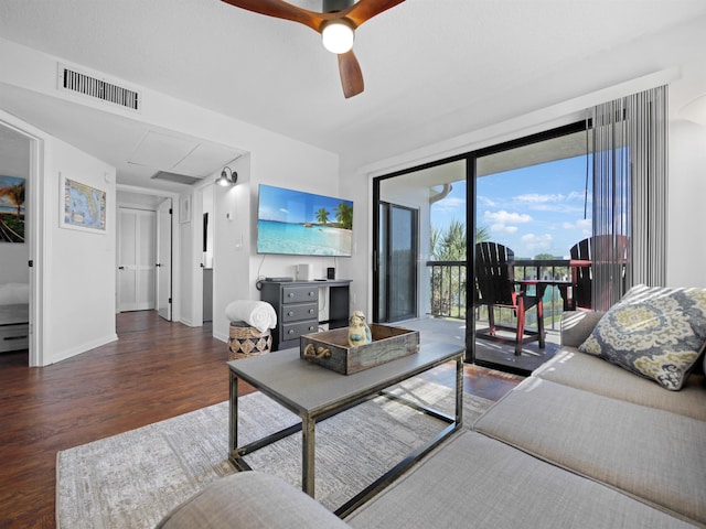 4250 S A1A Unit D33, Saint Augustine, FL 32080 - living room featuring wood finished floors, a ceiling fan, and baseboards