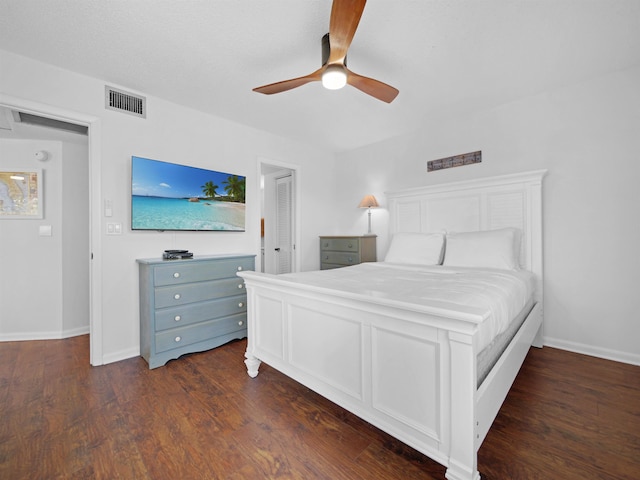 4250 S A1A Unit D33, Saint Augustine, FL 32080 - bedroom with dark wood-type flooring, ceiling fan, and baseboards