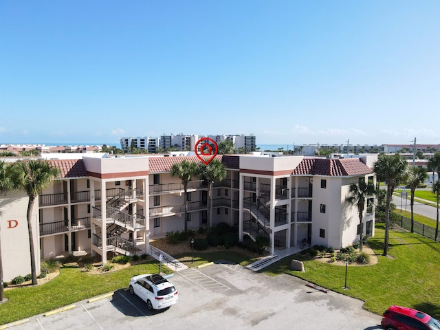4250 S A1A Unit D33, Saint Augustine, FL 32080 - view of apartment building / complex featuring uncovered parking