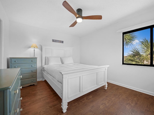 4250 S A1A Unit D33, Saint Augustine, FL 32080 - bedroom featuring dark wood-type flooring, ceiling fan, and baseboards