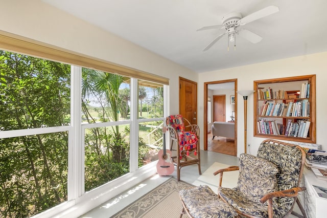 sunroom / solarium with ceiling fan