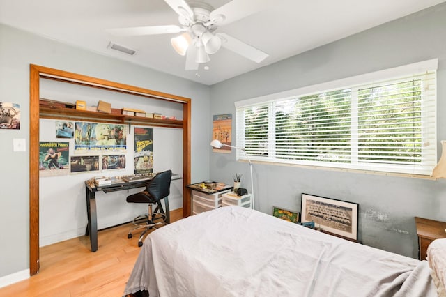 bedroom with ceiling fan and light hardwood / wood-style flooring