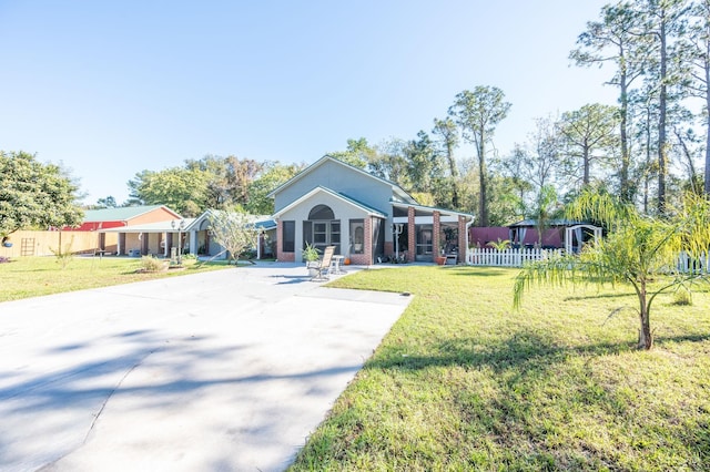 ranch-style home featuring a front yard