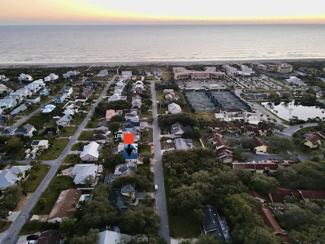 aerial view at dusk with a water view