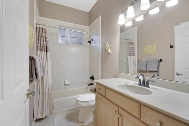 full bathroom with tile patterned flooring, shower / bath combo, vanity, and toilet