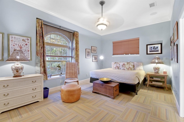 bedroom featuring ceiling fan and crown molding