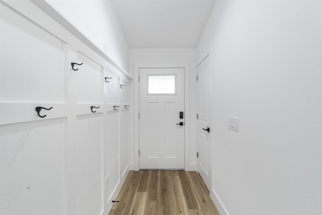 doorway to outside with light wood-style flooring