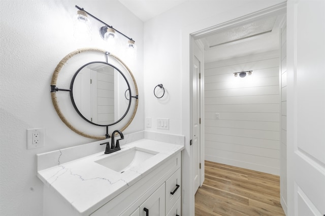 bathroom featuring vanity and wood finished floors