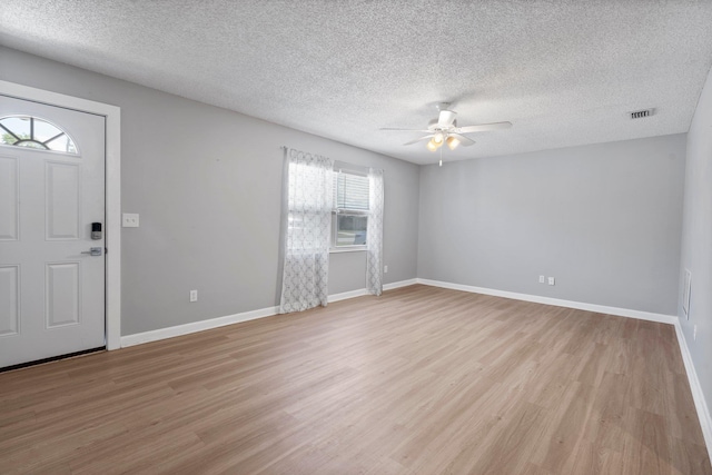 82 Andora St, Saint Augustine, FL 32086 - entryway featuring light wood-style flooring, visible vents, ceiling fan, and a textured ceiling