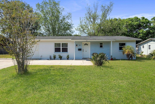 82 Andora St, Saint Augustine, FL 32086 - ranch-style house featuring a front yard and brick siding