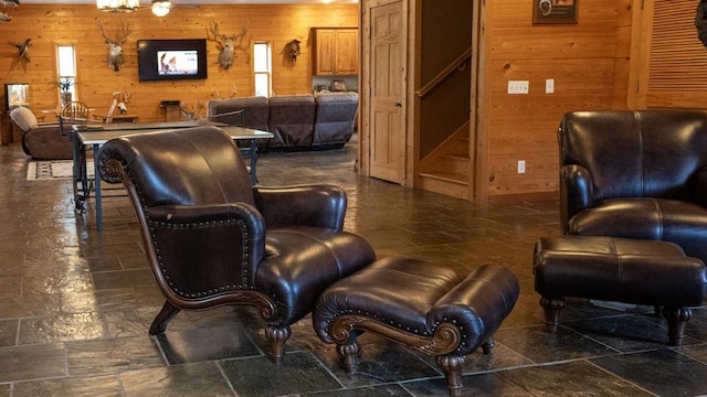 living area with wood walls