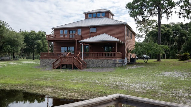 back of property with a lawn