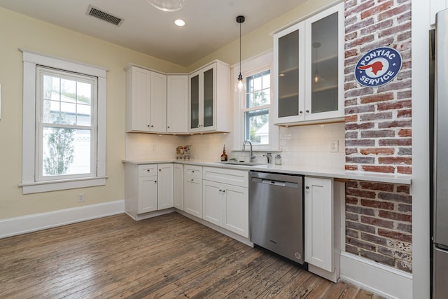 60 Saragossa St, Saint Augustine, FL 32084 - kitchen with light countertops, visible vents, decorative backsplash, stainless steel dishwasher, and a sink