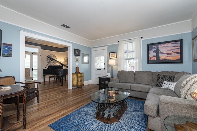 60 Saragossa St, Saint Augustine, FL 32084 - living area with french doors, wood finished floors, visible vents, and baseboards