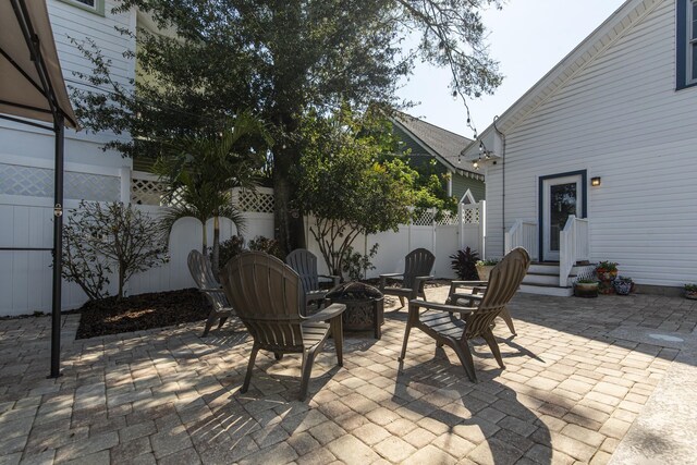 60 Saragossa St, Saint Augustine, FL 32084 - view of patio with fence private yard and an outdoor fire pit
