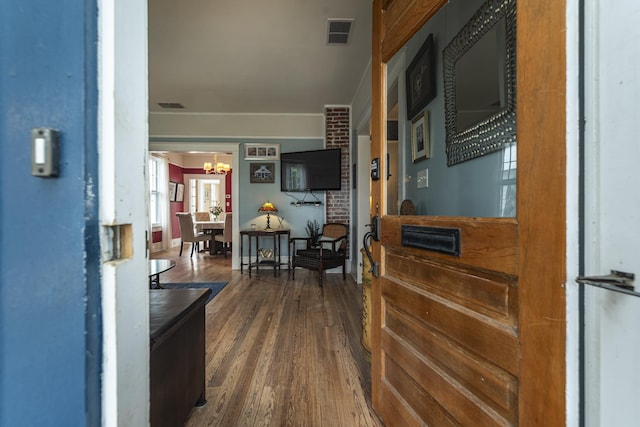 60 Saragossa St, Saint Augustine, FL 32084 - corridor featuring wood finished floors, visible vents, and a notable chandelier